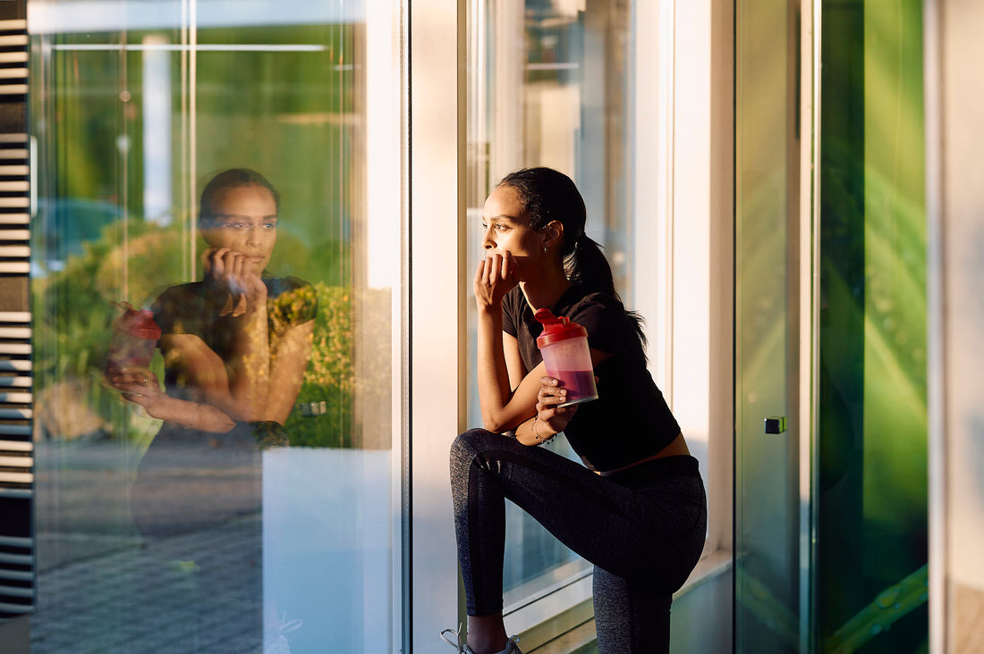 Woman in natural light considering her oral care choice