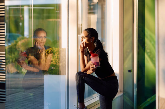 Woman in natural light considering her oral care choice