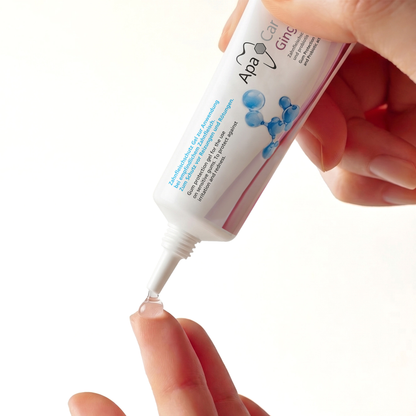Squeezing ApaCare Gingiva Gel onto a fingertip