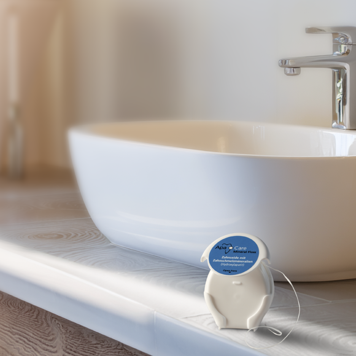 ApaCare Mineral Floss dispenser beside a bathroom sink