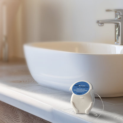 ApaCare Mineral Floss dispenser beside a bathroom sink